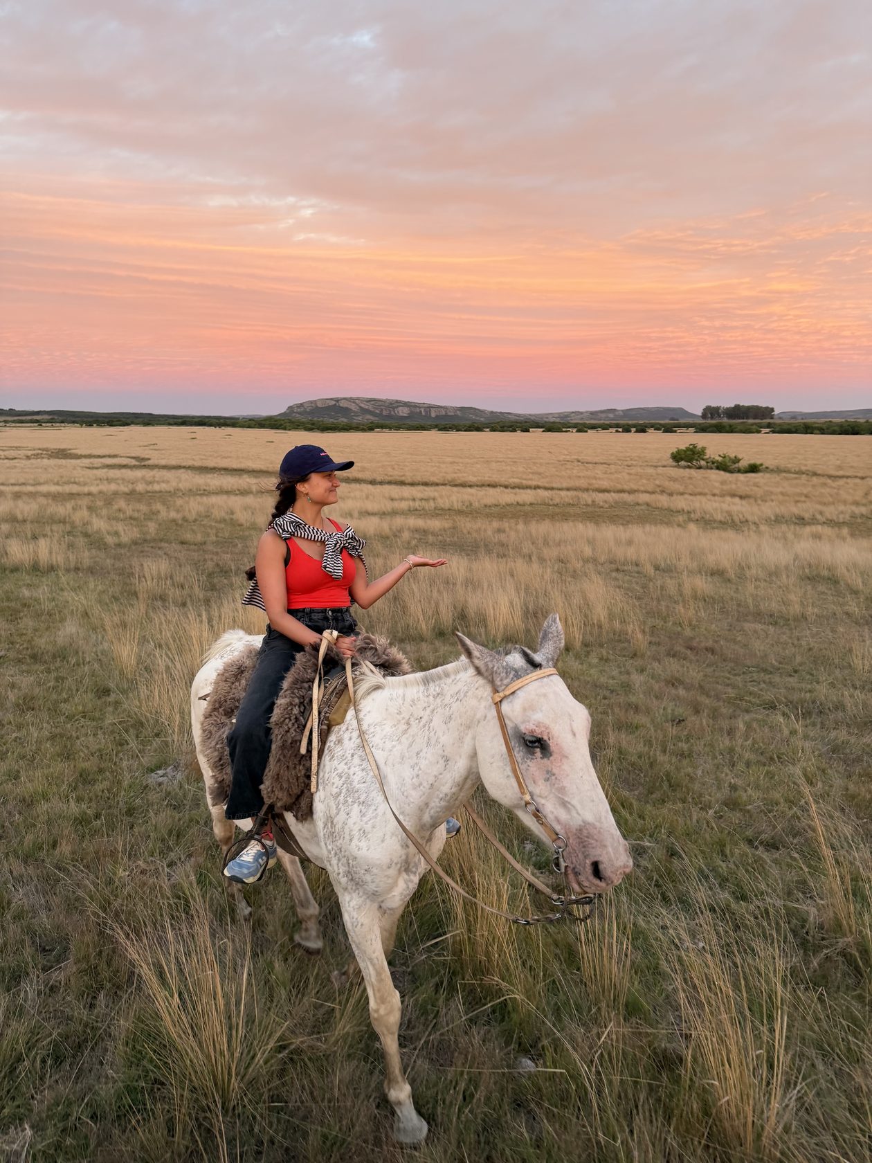 A guest riding at pink sunset, Uruguay